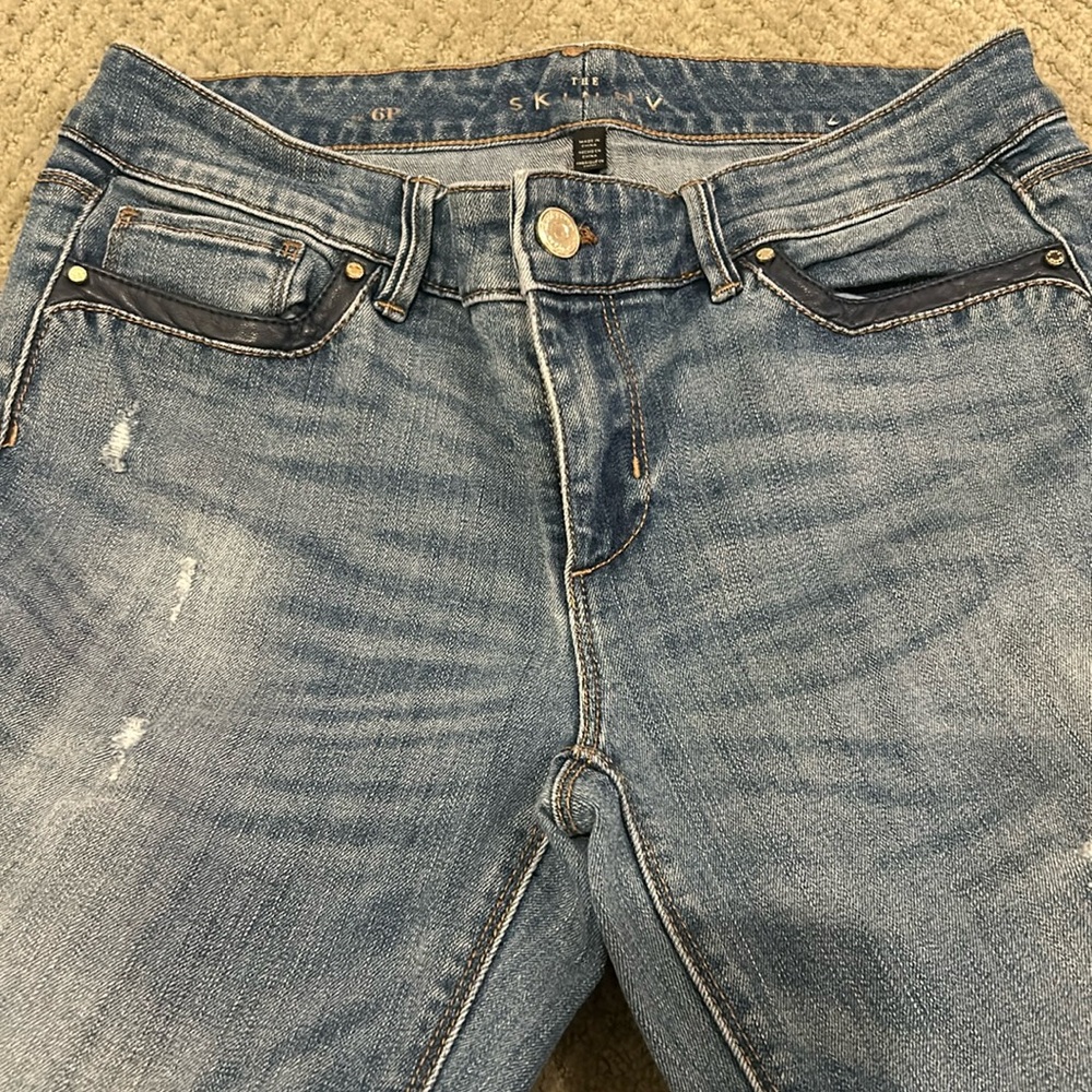 WHBM leather trimmed pocket skinny jeans.